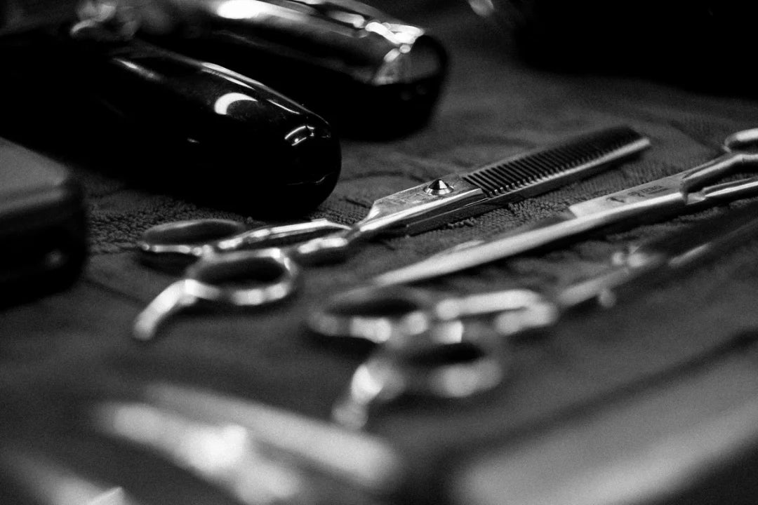 Scissors and clippers photographed with a subtle depth of field look.